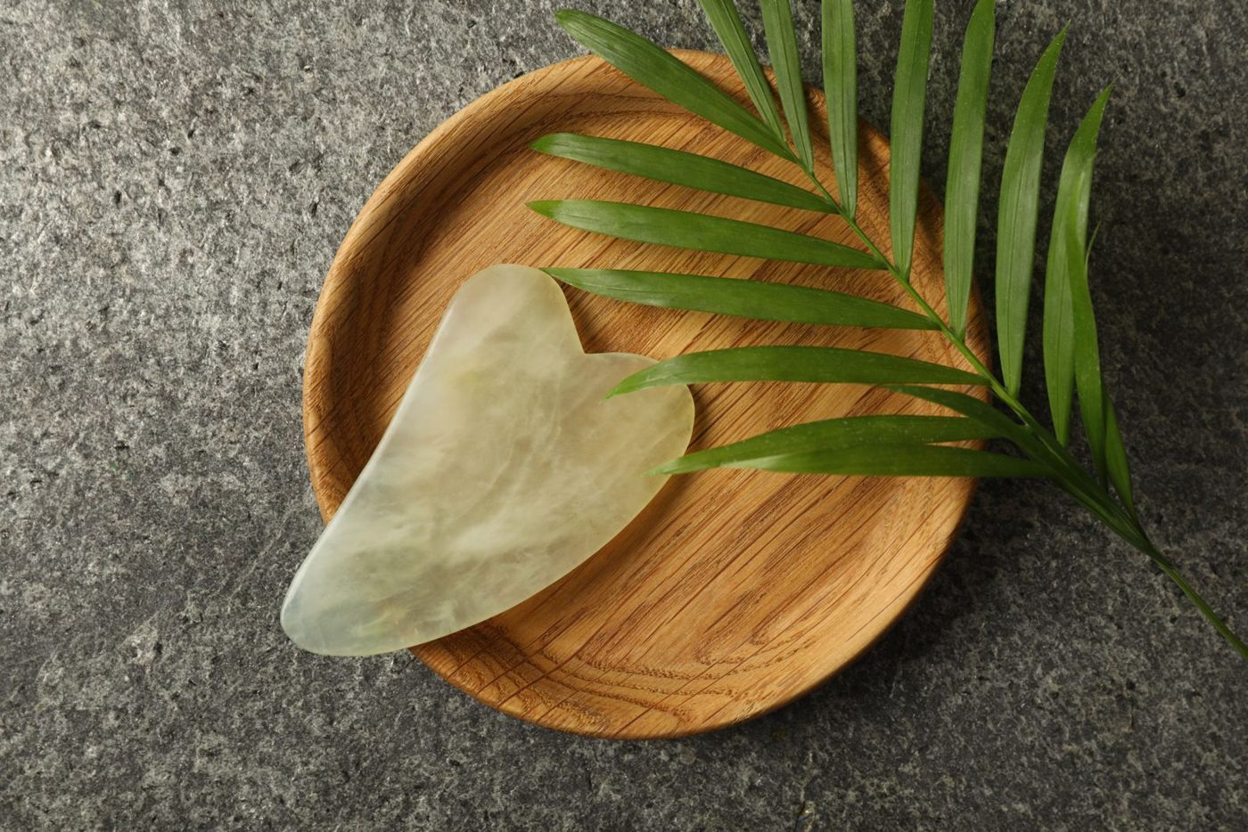 A rose quartz gua sha stone