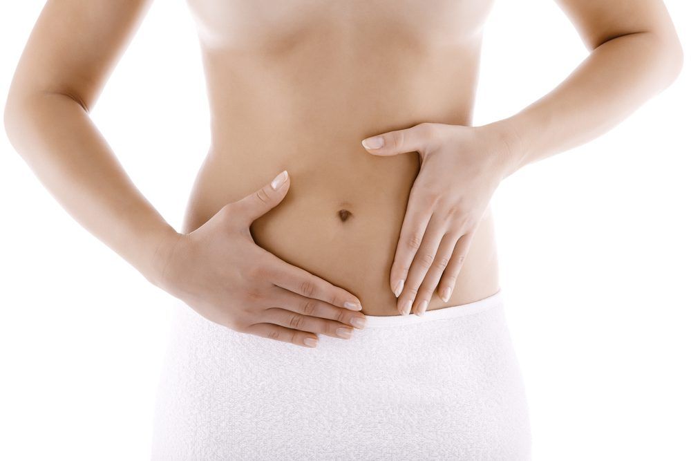 Hands resting gently on the belly